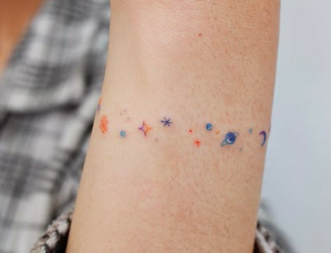 Are you looking for the best galaxy tattoo ideas? Check the galaxy tattoo designs listed below for your next tattoo session. Galaxy Tattoo Ideas, The Galaxy Tattoo, Stardust Tattoo, Star Tattoo On Shoulder, Tattoo Kids, Small Colorful Tattoos, Dandelion Tattoo Design, Cosmic Tattoo, Tattoo Session