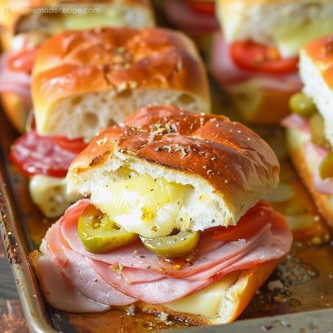 These Hot Italian Sub Sliders are loaded with ham, salami, pepperoni, and provolone cheese, topped with spicy peppers, and baked to perfection. Italian Sliders Recipes, Hot Italian Sub Sliders Recipe, Hot Italian Sub Sliders, Subs At Home Easy Recipes, Homemade Italian Hoagies, Spicy Italian Sandwich Recipes, Spicy Italian Sandwich, Italian Sub Sliders, Sub Sliders