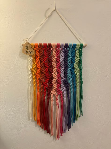 Brighten up your space with this one-of-a-kind macrame wall hanging! Approximately 25" long from top to bottom hanging on a 12" wooden dowel. *Please note that monitor settings, color settings, and lighting may cause shifts in product colors shown and slight variations may occur. Hook not included* Message me for custom orders, comments, questions, or concerns! Macrame Wall Hanging Colorful, Macrame Hammock Pattern, Diy Boho Wall Decor, Rainbow Macrame Wall Hangings, Colored Macrame, Yarn Macrame, Wall Macrame, Twine Crafts, Free Macrame Patterns