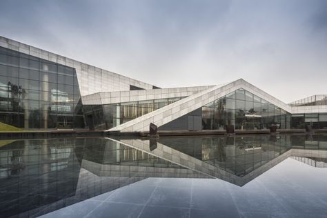 Built by SPARK in Chongqing, China with date 2011. Images by Fernando Guerra. SPARK’s playful Clubhouse in Chongqing has opened to the public. The Clubhouse is the first part of a series of leisu... Water Architecture, Arch Building, Chongqing China, Shigeru Ban, Steven Holl, Collections Photography, Reflecting Pool, Oscar Niemeyer, Water Reflections