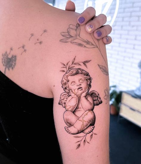 35 Gorgeous Kintsugi Tattoos With Meaning - Our Mindful Life Bow And Arrow Cupid, Kintsugi Tattoo Ideas, Kintsugi Tattoo, Cherub Tattoo Designs, Lego Tattoo, Cupid Tattoo, Hyper Realistic Tattoo, Cherub Tattoo, God Of Love