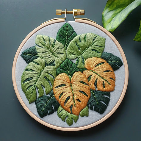 Add a touch of nature to your home with this Monstera Leaf Hand Embroidery Pattern! 🍃 This beautiful design features lush green and golden leaves, perfect for plant lovers and embroidery enthusiasts of all levels. 🌿 Create stunning hoop art that brings the beauty of the jungle indoors. Instantly downloadable, this pattern makes embroidery stitching fun and easy. Let’s stitch and bring these vibrant leaves to life! #HandEmbroidery #EmbroideryPattern #MonsteraLeaf #PlantLovers #DIYCrafts Monstera Embroidery, Leaves Wall Decor, 100 Crochet Stitches, Botanical Embroidery, Embroidery Diy, Monstera Leaves, Embroidery Stitching, Cadeau Diy, Wall Decor Modern