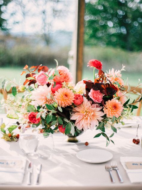 Poppies & Posies arranged this lush, organic fall-inspired centerpiece. Packed with dahlias, ranunculus, roses, and autumn foliage, the arrangement sits pretty at a seasonal reception. Dahlia Centerpiece, Dahlias Wedding, Low Centerpieces, Wedding Centerpiece Ideas, Wedding Flowers Decor, Unique Wedding Flowers, Fall Wedding Centerpieces, Rustic Fall Wedding, Rustic Wedding Centerpieces