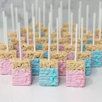 45 Delicious Gender Reveal Food Ideas to Share Your Exciting News Rice Krispie Gender Reveal Treats, Gender Reveal Ideas Brunch, Pink And Blue Rice Krispy Treats Gender Reveal, Pink And Blue Pretzels Gender Reveal, Gender Reveal Side Dishes, Gender Reveal Rice Crispy Treats, Dessert Table Gender Reveal Ideas, Gender Reveal Ideas Snacks, Fall Gender Reveal Desserts