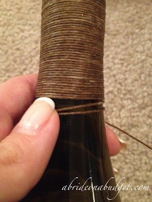 PInned lots of cute ideas for twine wrapped bottles but none had a tutorial!! So I found my own :) Twine Wrapped Bottles, Wrapped Bottles, Wine Bottle Project, Wine Bottle Centerpieces, Twine Diy, Wrapped Wine Bottles, Country Ideas, Bottle Centerpieces, Wedding Country