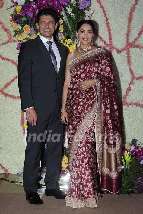 Madhuri Dixit attends Sooraj Barjatya's son Devansh Barjatya's wedding reception with her hubby  #celebrity #fashion #style #celebrityfashion #celebritystyle #outfitideas #outfitinspiration #celebritycouple #saree #menswear Benaras Sarees, Rekha Saree, Celebrity Saree, Simple Saree Designs, Gk Questions And Answers, Celebrity Couple, Fancy Sarees Party Wear, Simple Sarees, Gk Questions