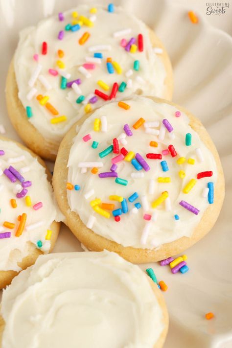 Frosted sugar cookies topped with rainbow sprinkles on a white plate. Simple Sugar Cookie Recipe, Christmas Cookie Frosting, Celebrating Sweets, Cookie Glaze, Cookie Icing Recipe, Simple Sugar, Sugar Cookie Icing, Sugar Cookie Recipe, Sugar Cookie Frosting