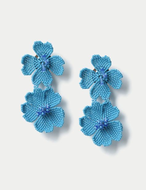 These Beaded Flower Motif Drop Earrings are handcrafted in India, featuring beaded detail these are the perfect addition to your earring collection.