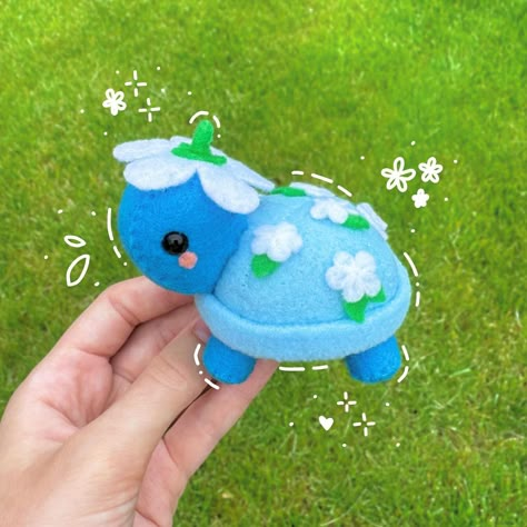 i love this little blue flowery turtle🩵 there are a lot of different color combinations i can do with this style so i’m excited!!🪷 #felt #feltplush #plushies #plush #cute #squishmallow #kawaii #floral #handmade #art #handsewing #turtle #daisy Blue Felt Crafts, Sewing Plushies, Felt Turtle, Turtle Plushie, Felt Plushie, Different Color Combinations, Blue Turtle, Turtle Plush, Felt Crafts Patterns