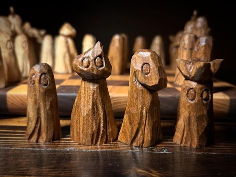 Chess set #2 complete. The light pieces are basswood and the dark are butternut. No sanding or painting, so you’ll see all the grains, knots, worm holes, flaws, imperfections and all. . . . #whittling #woodcarving #woodcraft #ghostcollector #halloween #halloweendecor #chess #chessset Whittling Chess Pieces, Wood Carving Designs, Carving Designs, Whittling, Chess Set, Sanding, Chess, Wood Carving, Wood Crafts