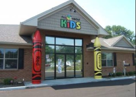 A child care building Preschool Building Design, Daycare Center Ideas Buildings, Daycare Building, Daycare Floor Plans, Daycare Center Ideas, Kindergarten Entrance, School Building Plans, School Gates, Outdoor Kindergarten