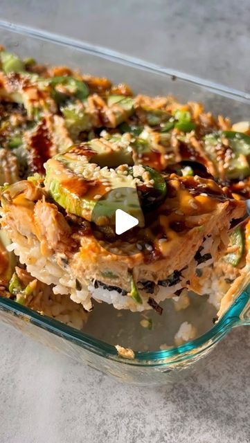 Gal Shua-Haim MS, RD on Instagram: "spicy salmon sushi bake! always a favorite in our house and a hit at every dinner table 

this deconstructed baked salmon roll is made from layers of sushi rice, furikake, spicy baked salmon, avocado, jalapeños and all the sauces 🤤 it’s perfect for a crowd or weeknight dinner!

comment “sushi bake” to get the recipe link sent directly to you, or google “something nutritious sushi bake” for the full recipe 🤍

https://somethingnutritiousblog.com/spicy-salmon-sushi-bake/" Teriyaki Salmon Sushi Bake, Spicy Salmon Sushi Bake, Sushi Bake Video, Salmon Sushi Bake Recipe, Salmon Sushi Bake, Sushi Bake Recipe, Spicy Salmon Sushi, Sushi Bake, Salmon Roll