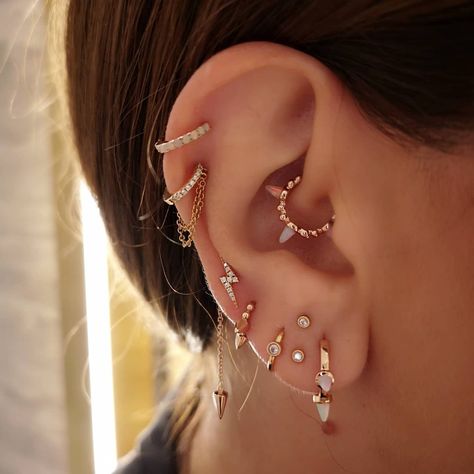 Danielle Robinson’s Instagram photo: “I've been working with my client @hebsherif for the longest time on this ear. Today, we installed some new daith jewellery, an opal…” Piercing Ear Chart, Constalation Piercing, Ear Stacks, Daith Hoop, Daith Jewelry, Copper Rose Gold, Cool Ear Piercings, Maria Tash, Stacked Earrings