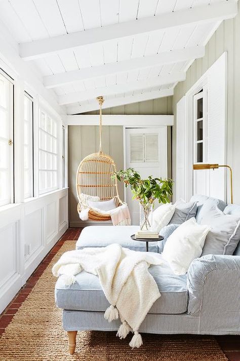 Walk into a sunroom and feel the relaxed atmosphere staring into outdoor views from a blue chase lounge seating area. Apartemen Studio, Cozy Sunroom, Koti Diy, Sunroom Decorating, Sunroom Designs, Ideas Hogar, Surf Shack, Sunrooms, Classic House