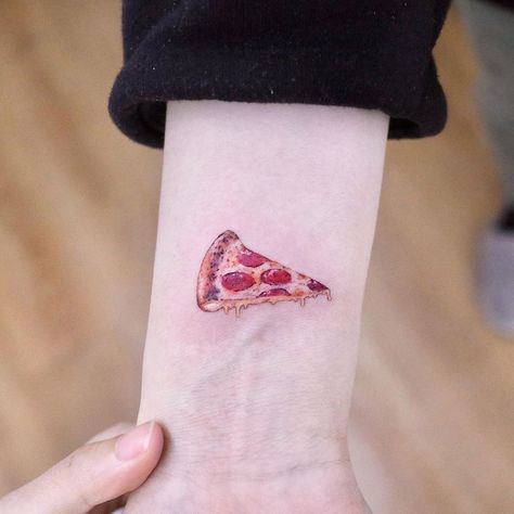 Considering getting a small wrist tattoo? These tiny wrist tattoos will inspire your next design. See them now! Pizza Tattoo, Lizard Tattoo, Tiny Wrist Tattoos, Tattoo Spots, Food Tattoos, Small Butterfly Tattoo, Light Tattoo, Planet Tattoos, Sun Tattoos