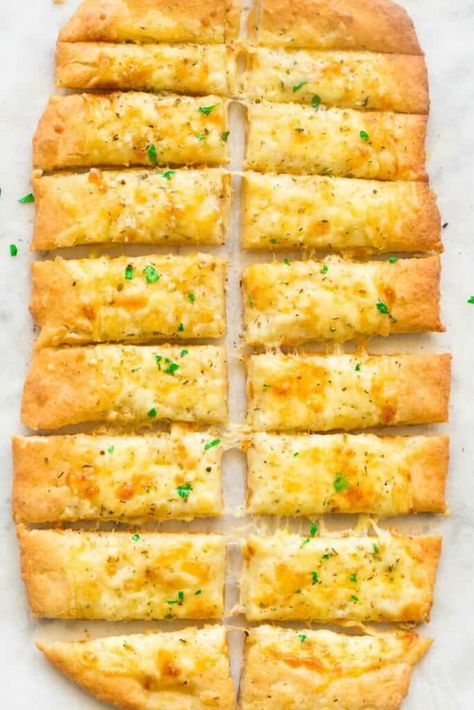 Cheesy Garlic Breadsticks made with 2 Ingredient pizza dough! 20 minutes, no yeast and seriously addictive! Gluten-free, and easily made vegan and dairy-free. Breadsticks No Yeast, Gluten Free Breadsticks, Cheesy Garlic Breadsticks, Garlic Breadsticks Recipe, Cheesy Garlic Breadsticks Recipe, 2 Ingredient Pizza Dough, Homemade Breadsticks, Cheese Bread Sticks, Garlic Bread Pizza