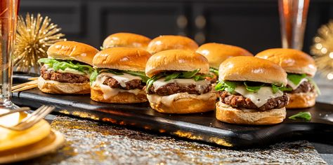 When the holidays come around, it’s fun to serve and be served fancy appetizers. Well, these little burger sliders deliver. Ground wagyu beef is formed into small patties, griddle fried and served on mini brioche buns topped with Sargento® Creamery Sliced Baby Swiss Natural Cheese, fresh arugula and a wild mushroom aioli. Wagyu Sliders, Mini Brioche Buns, Handheld Meals, Best Hamburger Patty Recipe, Mac And Cheese Pizza, Hamburger Recipes Patty, Patty Recipe, Hamburger Patty, Fancy Appetizers