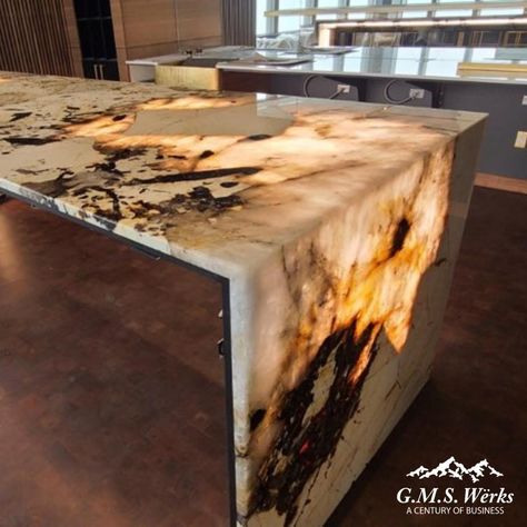 Waterfall countertops are one trend this year that we can get behind! Learn about waterfall countertops and why they are getting more popular here: https://www.gmswerks.com/blog/article/trending-waterfall-countertops #Countertops #KitchenCountertops Epoxy Waterfall Countertop, Light Up Countertop, Unique Countertop Ideas, Lumi Stone, Epoxy Countertop Kit, Waterfall Counter, Tub Surrounds, Luxury Living Room Inspiration, Countertop Kit