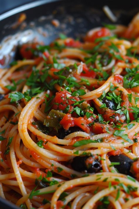 Indulge in the bold flavors of this classic pasta puttanesca recipe that will transport your taste buds straight to Italy. This quick and easy dish is perfect for a weeknight dinner or whenever you crave a comforting meal. The robust combination of tomatoes, olives, capers, and anchovies creates a delightful sauce that pairs perfectly with spaghetti or any pasta of your choice. Elevate your culinary skills with this delicious recipe that is sure to become a family favorite in no time. Pasta Puttanesca Recipe Authentic, Anchovies Pasta, Pasta Putanesca, Puttanesca Pasta, Pasta Puttanesca Recipe, Puttanesca Recipe, Anchovy Pasta, Authentic Pasta, Animal Foods