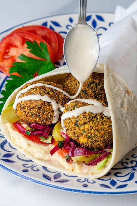 Level up your lunch game with this delicious wholesome Falafel wrap. Bursting with flavors from the crispy falafel, fresh veggies, creamy hummus and tahini dressing Falafel Aesthetic, Air Fryer Falafel Recipe, Air Fryer Falafel, Sumac Onions, Kachori Recipe, Hummus Sandwich, Falafel Sandwich, Falafel Wrap, Creamy Hummus