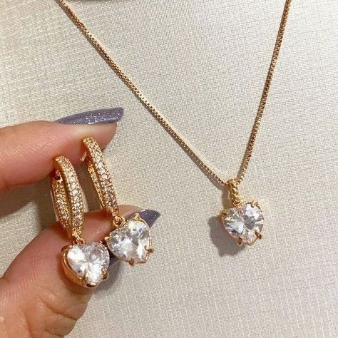 A set of heart-shaped diamond earrings and pendants to redefine your beauty. Are you ready to add more poise to your outfit with this incredible set? #ophiradiamonds #ophiradiamondsnyc #usajewelery #newyorkjeweler #diamondsets #diamondjewels #diamondsettings #pendantsetdesign #customizeyours #foryourspecialsomeone #jewelryofinstgram #pendantcollection #realdiamondpendant #minimaldesigner Heart Shaped Diamond Earrings, Heart Shaped Diamond Necklace, Heart Shaped Diamond Pendant, Diamond Pendant Set, Diamond Wrap Ring, Unique Gold Jewelry Designs, Diamond Pendant Jewelry, Gold Jewels Design, Creative Jewelry Photography