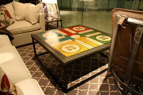 Ludo coffee table. #andrewmartin #interiordesign #decor #board #game #coffeetable #buttons #table Boardgame Cafe Interior, Cafe Games Ideas, Cafe Plan Architecture, Japanese Living Room Design, Lego Display Ideas, Tall Coffee Table, Board Game Themes, Board Game Room, Carrom Board