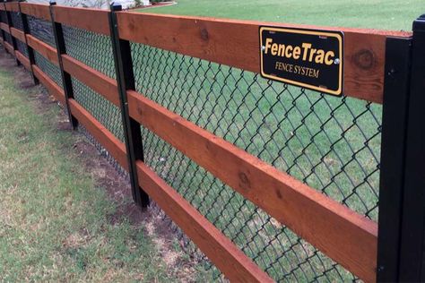 11 Backyard Fence Ideas [Beautiful Privacy For People, Pets, and Property] - Perimtec Chain Link Fence Wood Posts, Chain Link Fencing Ideas, Wood Chain Link Fence, Wood On Chain Link Fence, Wood And Chain Link Fence Ideas, Chain Link And Wood Fence, Wood Fence Over Chain Link, Fence With Metal Posts, Chain Link Fence Ideas