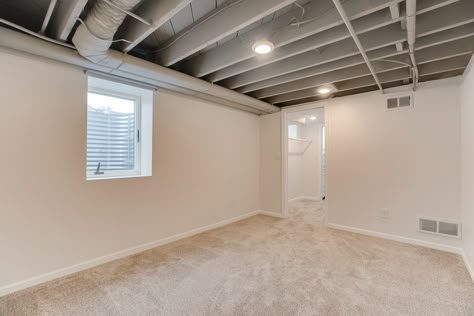 Low basement ceilings but want a finished space? No problem! Gray Exposed Basement Ceiling, Basements With Exposed Ceilings, Grey Basement Ceiling, Grey Exposed Ceiling, Gray Basement Ceiling, Painted Exposed Basement Ceiling, Exposed Basement Ceiling Ideas, Low Ceiling Basement Ideas, Painted Basement Ceiling