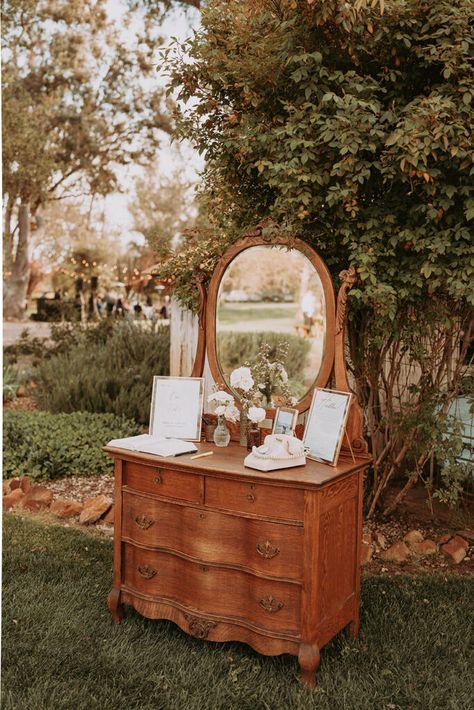 Wedding Theme Ideas Vintage, Rustic Wedding Decor Diy Outdoor Reception Ideas, Low Budget Wedding Reception, Antique Dresser Wedding Decor, Soft Country Wedding, Thrifted Wedding Chairs, Woodsy Vintage Wedding, Wedding Dresser Decor, Small Thrifted Wedding