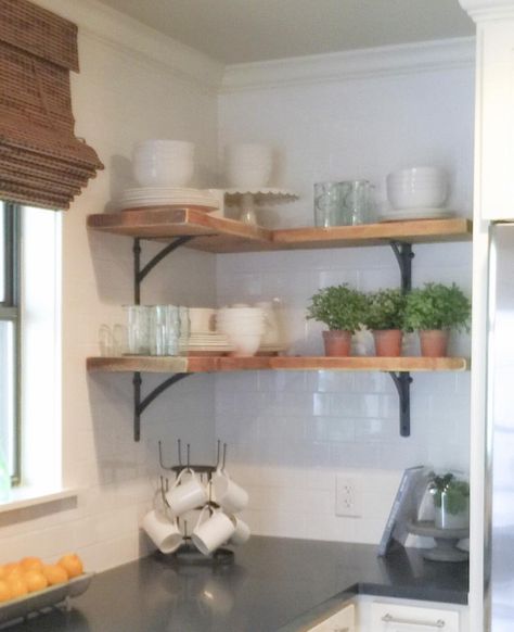 Shanty Sisters on Instagram: “Simple corner shelves! We bought 4 inexpensive metal brackets and one 2x12 board from Home Depot. Each "L" is created by joining a 24" board and a 35" board using pocket hole screws. To hold the wood in place you just attach 1" screws through the brackets and into the wood. We stained the wood with Varathane stain in Early American and distressed it a bit with a sander! LOVE how much it added to this kitchen for under $50! Corner Shelves Diy, Corner Shelves Kitchen, Diy Corner Shelves, Kitchen Corner Shelves, Corner Shelf Ideas, Kitchen Shelf Decor, Kabinet Dapur, Kitchen Corner, Room Shelves