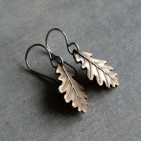 "These wonderful eye-catching nature inspired real oak leaf earrings are made of shiny golden bronze and sterling silver in petite size. So dainty! Adorable pieces of nature captured in silver. All metal components were made by me: earrings were crafted from bronze and sterling silver (earwires), uniquely textured, carved and polished to bring out the highlights. They were darkened darkened for a wonderful rustic look.  A tiny piece of art, gorgeous and lightweight! These pretty earrings offer a Oak Leaf Earrings, Real Leaf, Visual Style, Magical Jewelry, Botanical Jewelry, Oak Leaf, Funky Jewelry, Pretty Earrings, Dream Jewelry