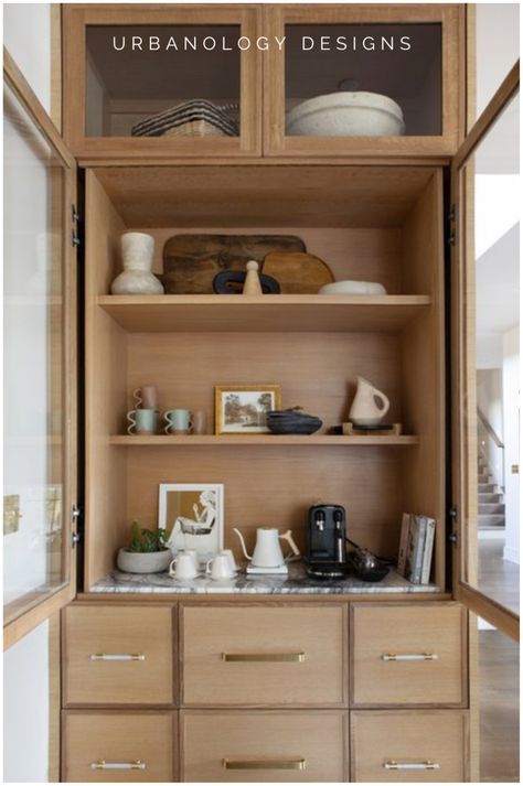 Discover a clean modern kitchen design featuring sleek kitchen cabinets and natural wood accents. This project incorporates built-in shelves and open shelving, blending practicality with style. Explore how relaxed modern interior design elevates your kitchen decor, seamlessly integrating home accents and functional storage solutions. See other interior design projects, interior design tips, and discuss our interior design services at urbanologydesigns.com. Sleek Kitchen Cabinets, Open Shelving Decor, Natural Wood Cabinets, Home Transformation, Open Kitchen Shelves, Sleek Kitchen, Simple Kitchen, Open Concept Kitchen, Park Homes