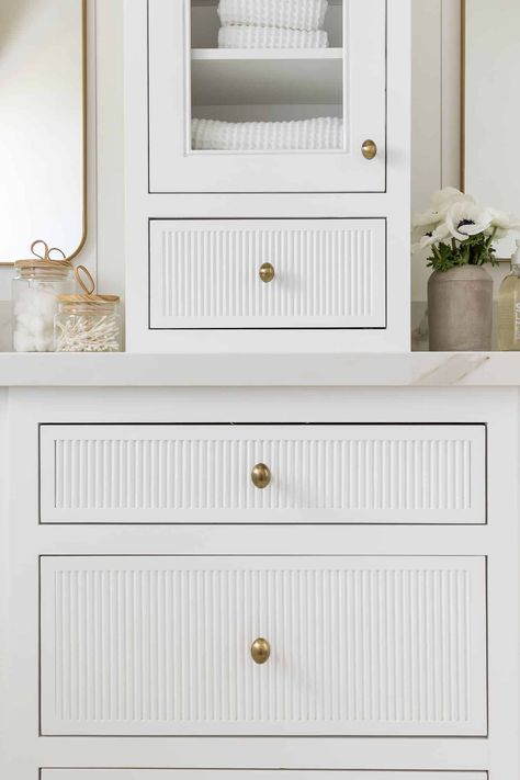 The Look: Port Newport P.2 - Mindy Gayer Design Co. Brooke Wagner Bathroom, White Fluted Kitchen Cabinets, White Reeded Vanity, Gold Bathroom Sconces, Coastal Family Home, Interior Doors Styles, Drømme Bad, Mindy Gayer Design, Blue Nightstands