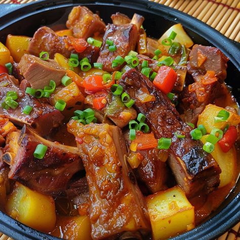 🍖🌶 Transform your meal with Pork Ribs Caldereta, a rich, hearty Filipino stew! #PorkRibsCaldereta #FilipinoCuisine 🍽️ Pork Ribs Caldereta 🛒 Ingredients: 1 kg pork ribs, cut into pieces 200 grams tomato sauce 100 grams liver spread 100 grams bell peppers, sliced 100 grams potatoes, cubed 50 grams carrots, sliced 3 cloves garlic, minced 1 onion, chopped 30 ml soy sauce 500 ml water Salt and pepper to taste Chili flakes (optional) 👩‍🍳 Instructions: Brown Ribs: In a pot, brown pork ribs with ... Twisted Recipes, Family Dining, Trending Recipes, Pork Ribs, Hearty Meals, Tomato Sauce, Family Dinner, Pork Recipes, Tasty Dishes