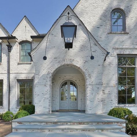 Stone House With Black Shutters, Stone And Painted Brick House Exterior, German Shmere Brick House Exterior, German Shmere Brick House, Stone And Brick House Exterior, Black Gutters, White Wash Brick Exterior, Painted Brick House Exterior, Stone Entryway