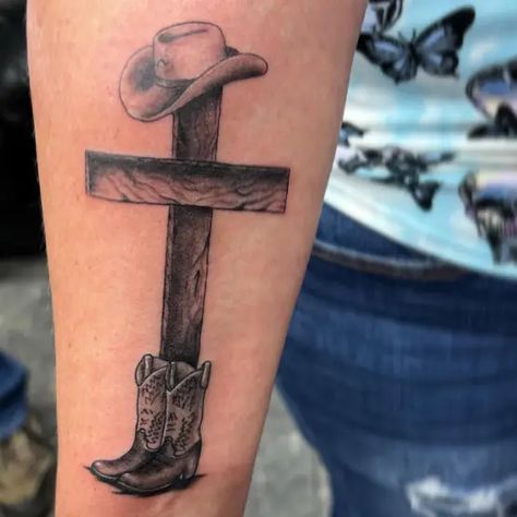 Electrik Needle Tattoo Cowboy Hat Memorial Tattoo, Country Forearm Tattoo Men, Cross With Cowboy Hat Tattoo, Cowboys And Angels Tattoo, Judas Ate Too Tattoo, Cross Tattoo On Ribs, Western Tattoos For Men, Cowboy Tattoos For Men, Brilliant Tattoo