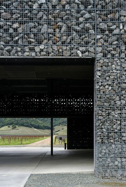 Winnery from class. I love the way light peeks through the cracks. I can also almost hear the water dripping slowly after a rainfall. Perfect. Wineries Architecture, Building Skin, Gabion Wall, Stone Facade, Contemporary Elements, Stone Architecture, Rammed Earth, Modular Building, Facade Architecture