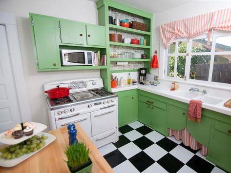 Green cabinets and a black and white tile checkered floor give this adorable kitchen, featured on HGTV.com, a decidedly-vintage style. Checkered Floor Kitchen, Cherry Wood Kitchen Cabinets, Kitchen Cabinets Upgrade, Mid Century Modern Kitchen Design, Kitchen Colour Combination, Checkered Floor, Bold Kitchen, Vintage Style Kitchen, Mid Century Modern Kitchen