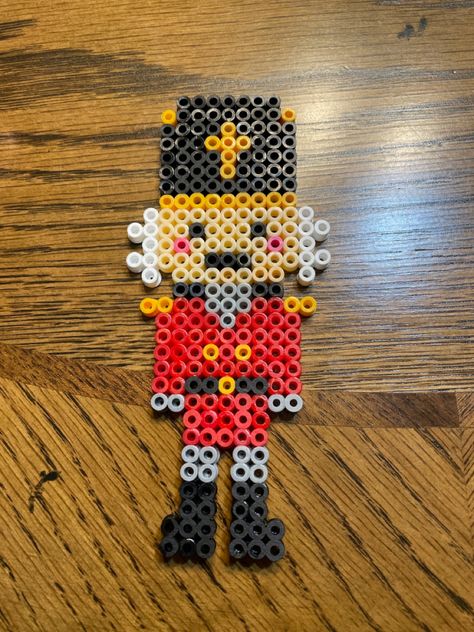 Nutcracker Perler Beads, Nutcracker Perler Bead Patterns, Candy Cane Perler Bead Patterns, Perler Beads Christmas Patterns, Pyssla Ideas Christmas, Christmas Iron Beads, Perel Beads Ideas, Perler Bead Christmas Patterns, Christmas Beads Ideas