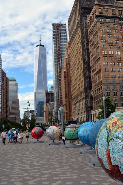 "Cool Globes" art exhibit in  Battery Park, Manhattan Battery Park Nyc, Nyc Billboard, New York Sightseeing, York Things To Do, Travel Honeymoon, New York City Vacation, Dubai Skyscraper, Battery Park, Nyc Park