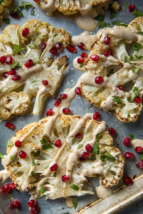 Roasted Cauliflower with Garlic Tahini Sauce and Pomegranate - Will Cook For Friends Garlic Tahini Sauce, Easy Roasted Cauliflower, How To Cook Cauliflower, Sommer Mad, Tahini Sauce, Think Food, Roasted Cauliflower, Tahini, Pomegranate