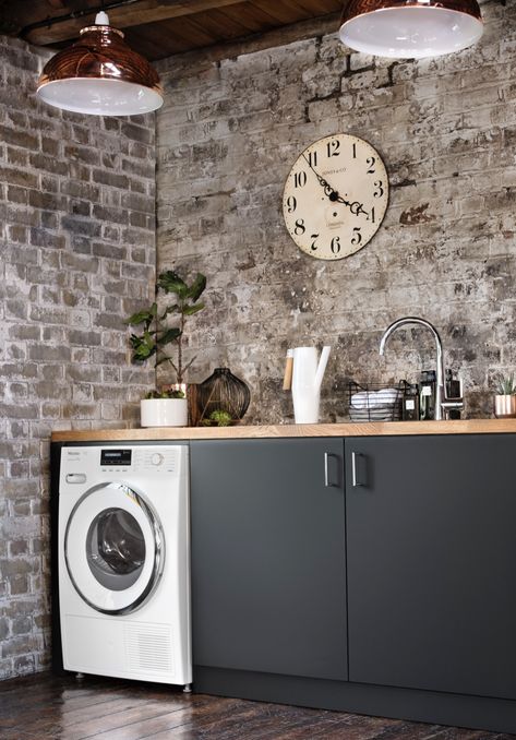 Create an industrial-style utility room by pairing dark surfaces with chrome coloured accessories. Laundry Room Tables, White Laundry Rooms, Rustic Laundry Rooms, Vintage Laundry Room, Monochrome Decor, Laundry Room Doors, Laundry Room Sink, Modern Laundry Rooms, Laundry Room Inspiration