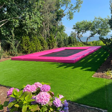 A pink in-ground super trampoline with a beautifully landscaped yard on a sunny day. I’m Ground Trampoline, Giant Trampoline, Big Trampoline, Underground Trampoline, Trampoline Ideas, Elevate Yourself, Crib Ideas, In Ground Trampoline, Adult Playground