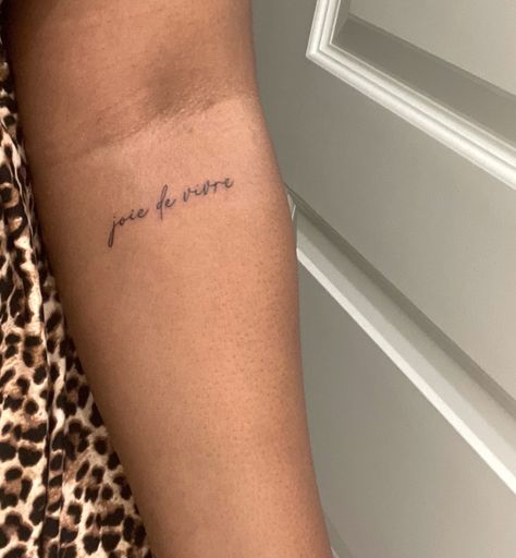 Joy Of Living Tattoo, Inner Arm Word Tattoo, The Good I’ll Do Tattoo, And So It Goes Tattoo, Back Of Arm Word Tattoo, Tattpp Ideas Woman, Remember To Live Tattoo, Joy Tattoo Ideas, Joy Tattoo