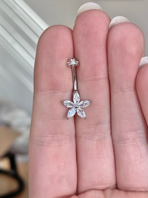 This cute flower belly button ring is made with surgical steel. A unique design, this marquise flower belly ring is a great minimalist/delicate option, very feminine and floral. Drop jaws with this body jewelry. This piece is internally threaded *Also available in silver and rose gold options. These pieces are 316L surgical steel but not 14k gold plated* Details & Size: ♥ 316L Surgical Steel ♥ Internally threaded ♥ Size: 10mm bar, 14G ♥ Every purchase comes with an Elara gift box For sanitary purposes, piercing items are non-returnable, so please double check sizing and message me if you have any questions! Belly Piercing Jewelry Silver, Navel Piercing Jewelry Silver, Button Piercing Belly, Stud Belly Button Piercing, Cute Piercings Belly Button, Flower Belly Ring, Silver Belly Ring, Bottom And Top Belly Button Piercing, Belly Piercing Jewelry Unique