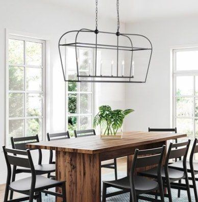 Upgrade your kitchen or dining room with the Linear Lantern 6-Light Chandelier by DecoMust. This linear pendant with 6 candle-style lights effortlessly blends sleek modern or farmhouse charm into your space. The carefully crafted frame creates a chic minimalist silhouette, featuring a horizontal arm supporting 6 candelabra-style bulbs for a timeless look. Choose between two finish options (black or gold) to match your preference. Base Finish: Sat Lantern Dining Room Light, Farmhouse Dining Room Decor, Chandelier Candle, Table Lamps Kitchen, Modern Farmhouse Dining Room, Modern Farmhouse Dining, Island Chandelier, Lantern Chandelier, Kitchen Updates