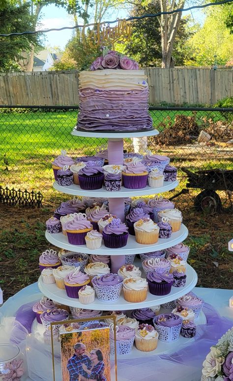 Sweet 16 Decorations Purple And Gold, Purple Cake With Cupcakes, Purple Cake Table Decorations, Lilac Cupcakes Wedding, Cupcakes For Quinceanera, Lavender Themed Cupcakes, Sweet 16 Dessert Table Ideas Purple, Purple Wedding Desserts, Wedding Cupcakes Ideas Purple