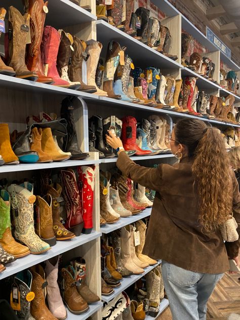 Woman in brown jacket looking at a wall full of cowboy boots Cowboy Boot Collection, Aesthetic Fit, Girl Cowboy Boots, Bday Gifts, Aesthetic Fits, Cowboy Boot, Boot Shop, Cowboy Boots, Nashville