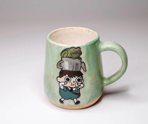 Over the garden wall mugs dropping tonight at 6pm MT! There's only three of them, but I wanted to put them up earlier in time for spooky season 🎃 #spookyvibes #overthegardenwall #ceramicsofinstagram #functionalceramics #gregwirt Over The Garden Wall Tavern Keeper, Over The Garden Wall Ceramic, Over The Garden Wall Mug, Over The Garden Wall Frog, Over The Garden Wall Mugs, Over The Garden Wall Scenes, Over The Garden Wall Aint That Just The Way, Over The Garden Wall, Pottery Mugs