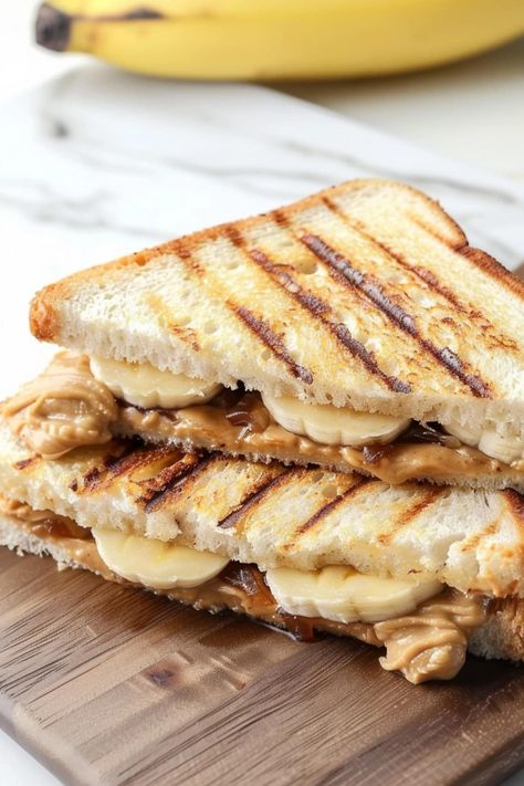 This grilled peanut butter and banana sandwich is over-the-top delicious! It's quick, easy, and will make you feel like a kid again. Prep Desserts, Peanut Butter And Banana Sandwich, Sandwich Aesthetic, Triplet Brothers, Earl Of Sandwich, Peanut Butter Jelly Time, Banana Sandwich, Butter Sandwich, Peanut Butter And Banana